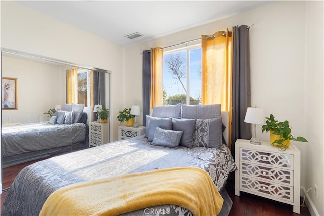 bedroom featuring dark hardwood / wood-style flooring