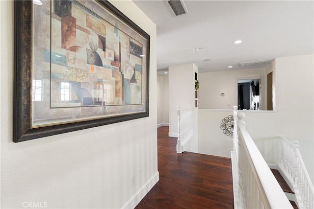 corridor with dark hardwood / wood-style floors