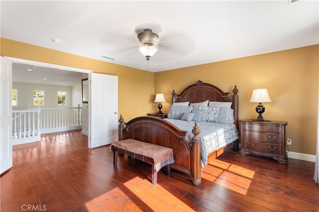 bedroom featuring dark hardwood / wood-style floors and ceiling fan