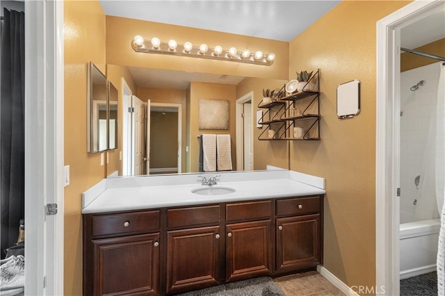 bathroom featuring vanity and  shower combination