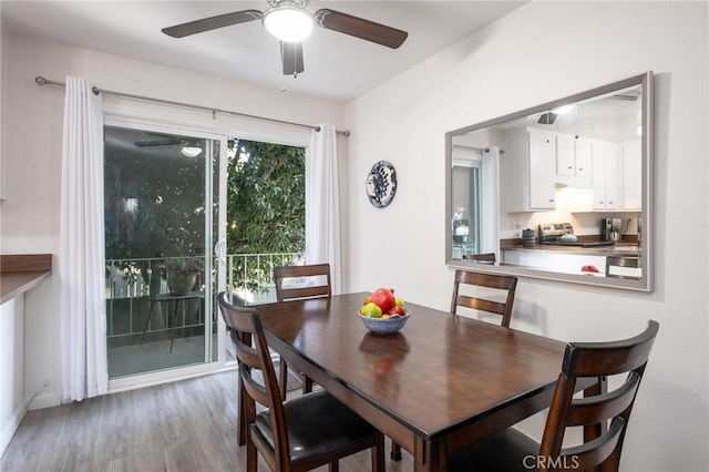 dining room featuring ceiling fan and light hardwood / wood-style flooring