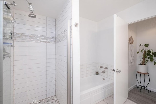 bathroom featuring separate shower and tub and hardwood / wood-style floors