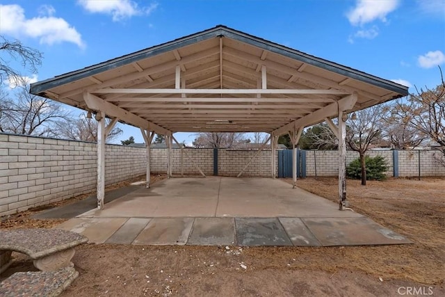 view of parking / parking lot featuring a carport