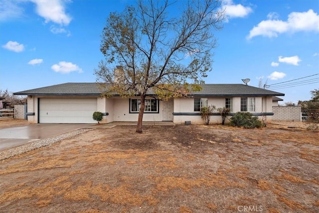 ranch-style home featuring a garage