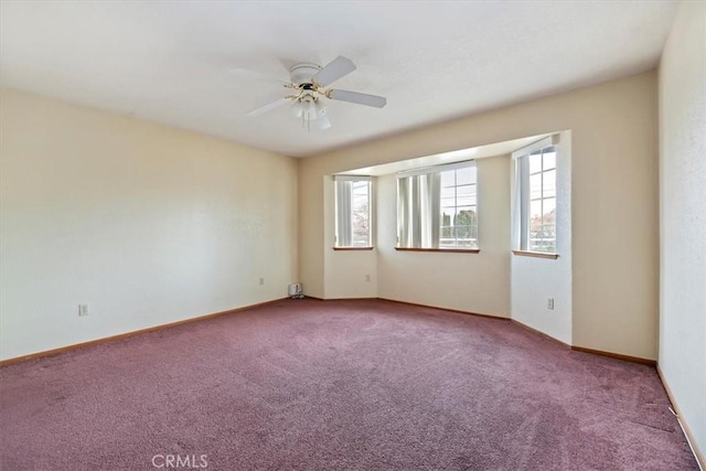 empty room with carpet floors and ceiling fan