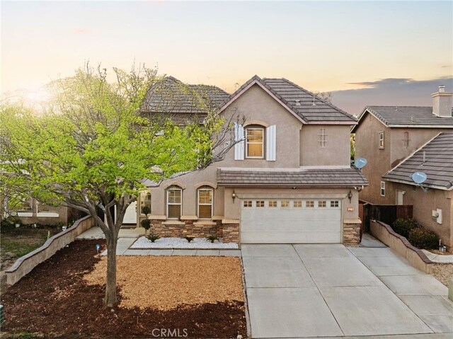 view of front of property featuring a garage