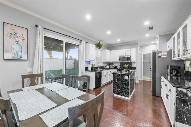 dining space with ornamental molding, dark wood-style flooring, and recessed lighting