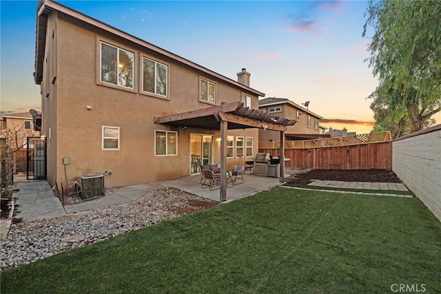 rear view of property with a pergola, a lawn, a fenced backyard, central AC, and stucco siding