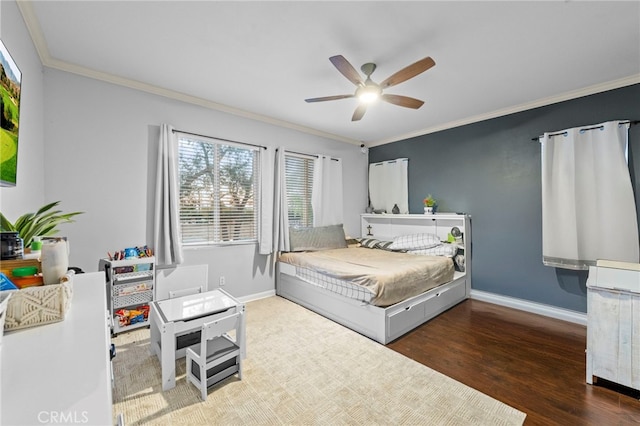 bedroom with a ceiling fan, baseboards, dark wood finished floors, and crown molding