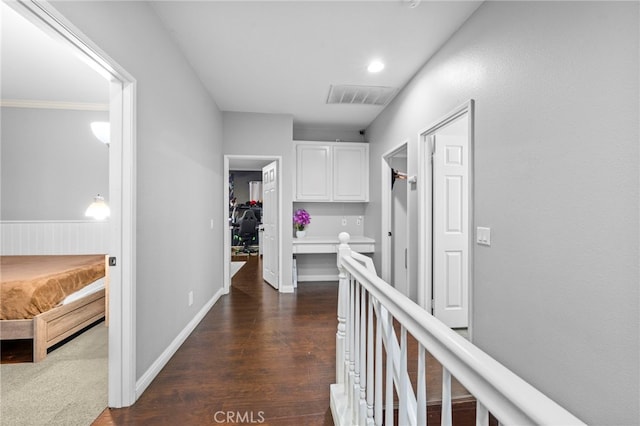 hallway featuring dark wood-type flooring