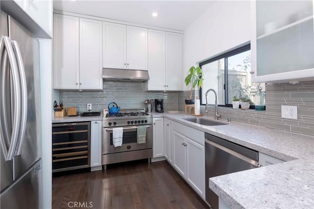 kitchen featuring white cabinetry, appliances with stainless steel finishes, sink, and wine cooler