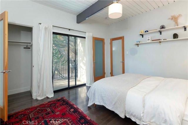 bedroom with dark wood-type flooring, access to outside, wood ceiling, and beam ceiling