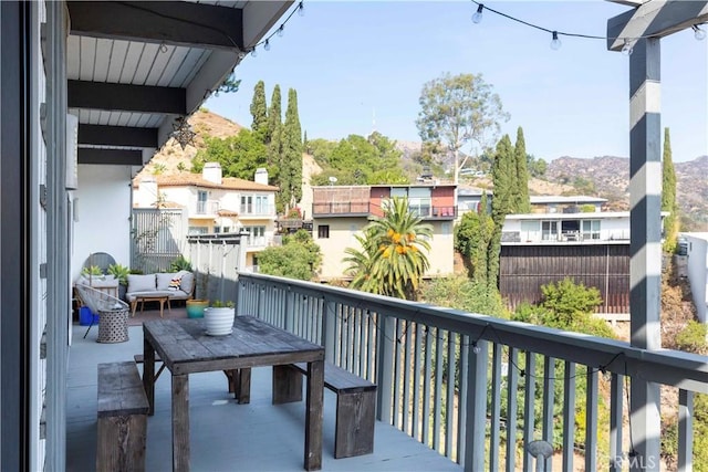 balcony with outdoor lounge area and a mountain view