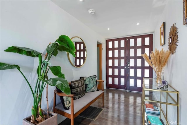 entryway with dark hardwood / wood-style flooring and french doors