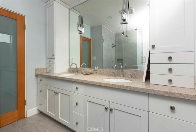 bathroom with vanity and an enclosed shower