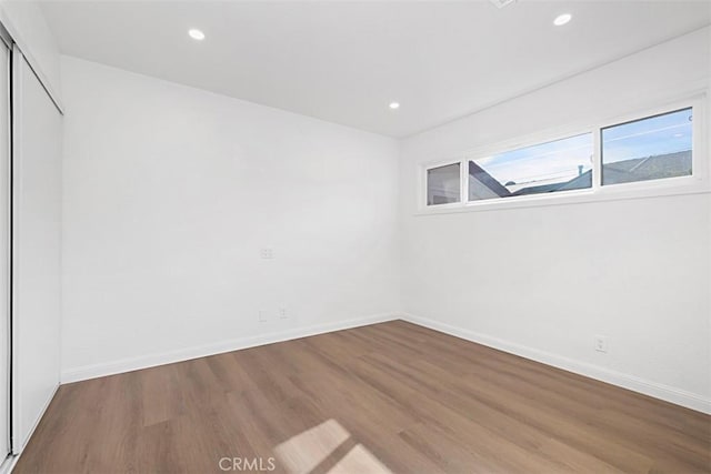 empty room featuring hardwood / wood-style flooring