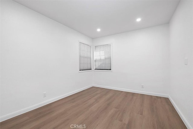 empty room featuring wood-type flooring