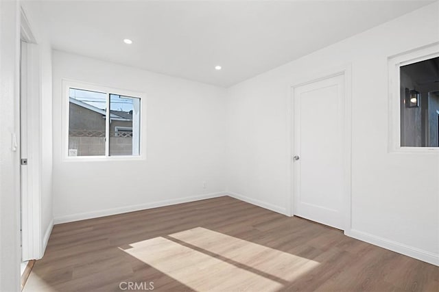 spare room featuring dark hardwood / wood-style flooring