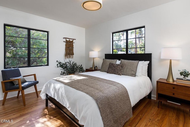 bedroom with hardwood / wood-style flooring