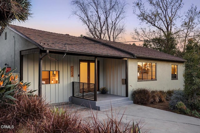 ranch-style home with a porch