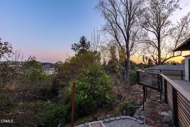 yard at dusk with a deck