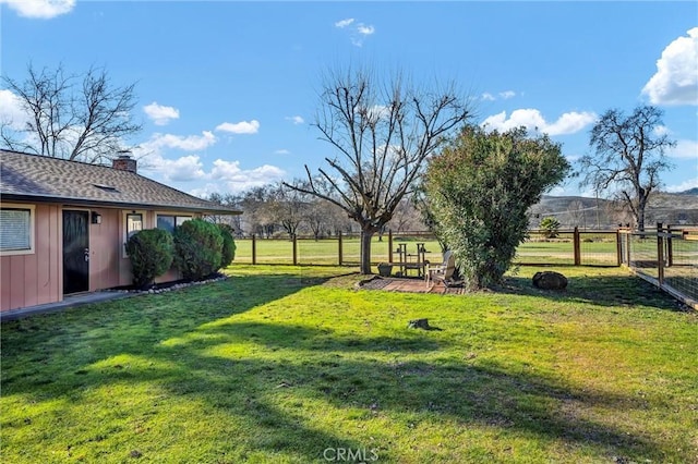 view of yard with a rural view