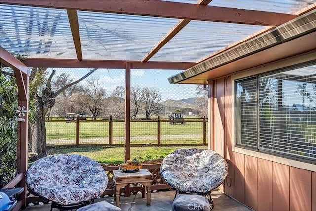 sunroom featuring a mountain view