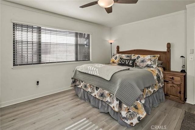 bedroom featuring ceiling fan and light hardwood / wood-style flooring