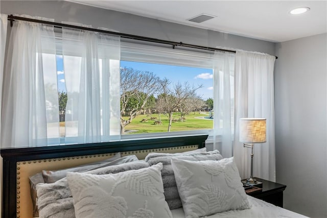 bedroom with recessed lighting and visible vents