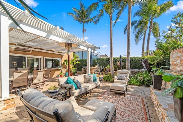 view of patio with outdoor dining space, an outdoor living space, and a pergola