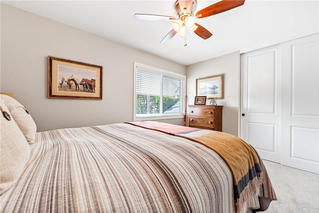 bedroom with ceiling fan, a closet, and carpet