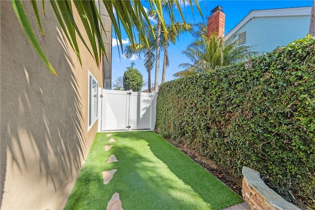 view of yard with a gate and fence