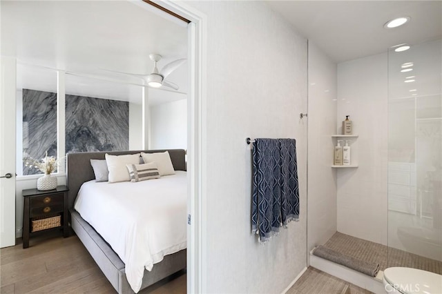 bedroom with light hardwood / wood-style flooring and ceiling fan