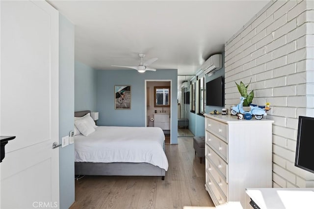 bedroom with a wall mounted air conditioner, ceiling fan, and light hardwood / wood-style flooring