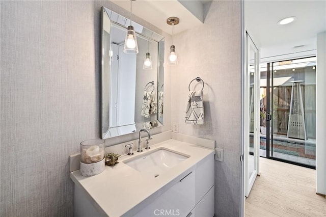 bathroom featuring vanity and hardwood / wood-style floors