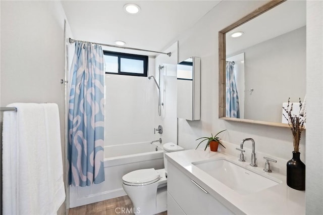 full bathroom with vanity, toilet, wood-type flooring, and shower / bath combo