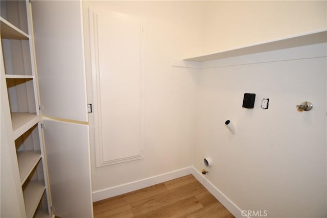 laundry area featuring light wood-type flooring