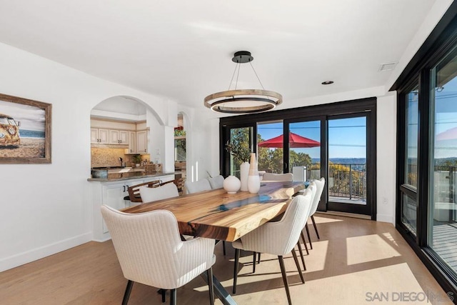 dining room with light wood-type flooring