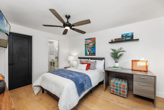 bedroom with connected bathroom, ceiling fan, and light wood-type flooring