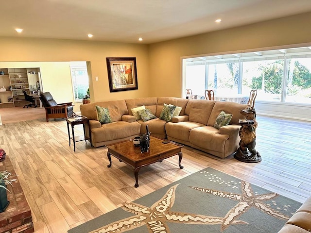 living room featuring a healthy amount of sunlight and light wood-type flooring