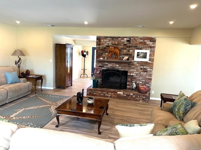 living room featuring hardwood / wood-style floors and a fireplace