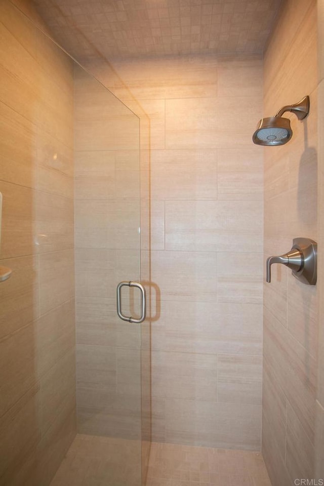 full bathroom featuring a shower stall