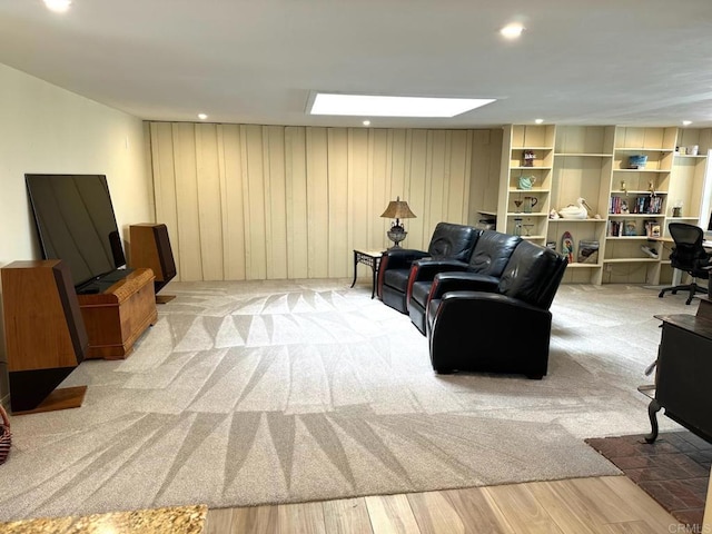 living room with light carpet, recessed lighting, and light wood-type flooring