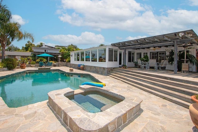 view of swimming pool with a patio, a pergola, and a pool with connected hot tub