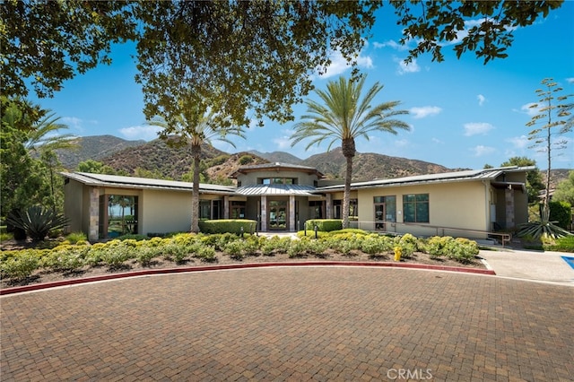 view of front of home featuring a mountain view