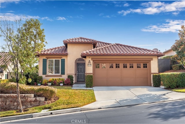 mediterranean / spanish-style home featuring a garage