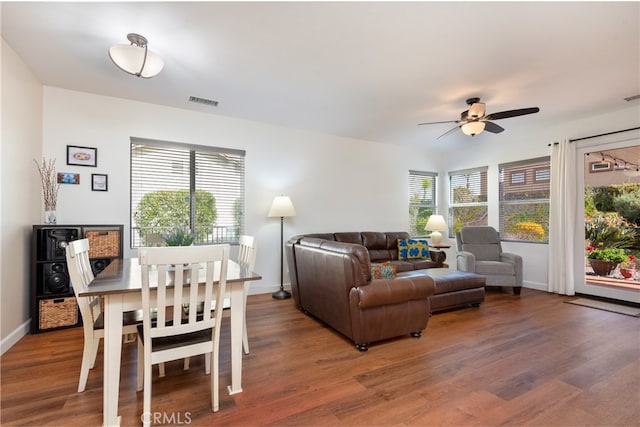 living room featuring ceiling fan and wood-type flooring