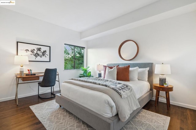 bedroom featuring dark wood-type flooring