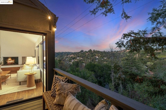 view of balcony at dusk