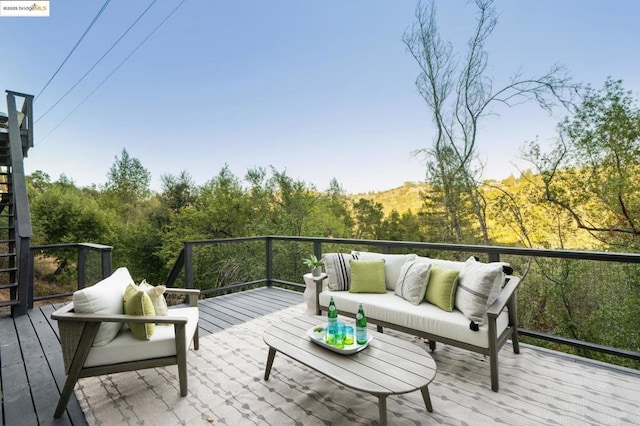 wooden deck with an outdoor hangout area